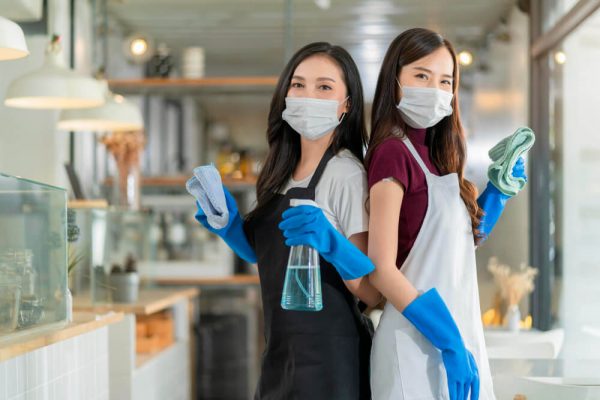 portrait_asian_waitress_with_apron_staff_wearing_protection_rubber